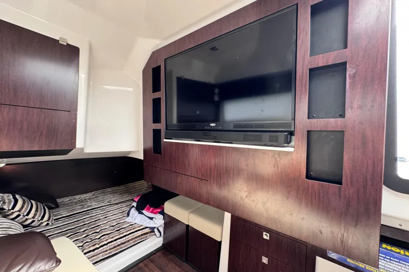 Slide: The Image of Interior of 2021 Monterey 378 Super Express with TV and cozy bed area. - 12