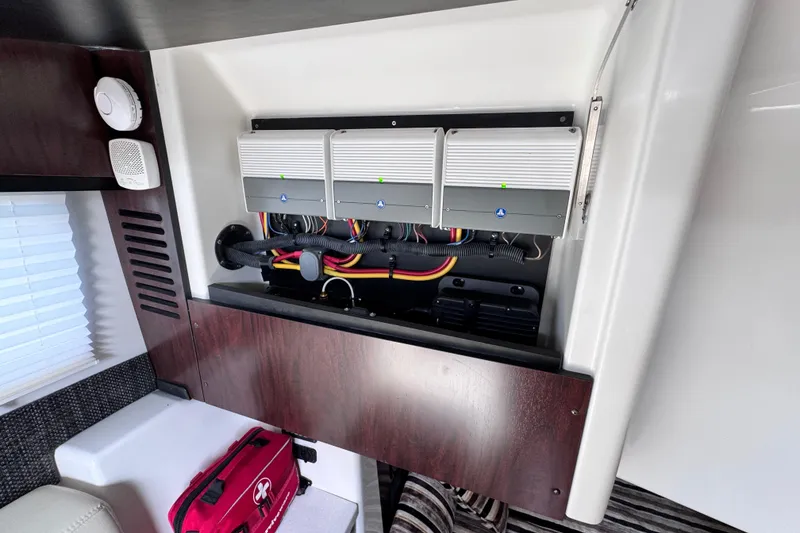 Slide: The Image of Interior view of 2021 Monterey 378 Super Express showcasing electrical panel and wiring. - 16