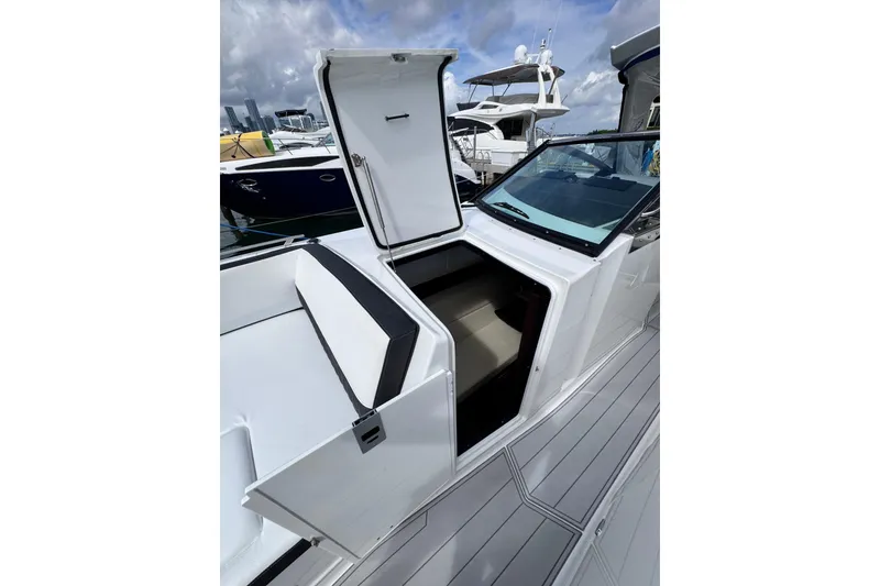 Slide: The Image of 2021 Monterey 378 Super Express boat with open cabin door, docked at marina. - 17