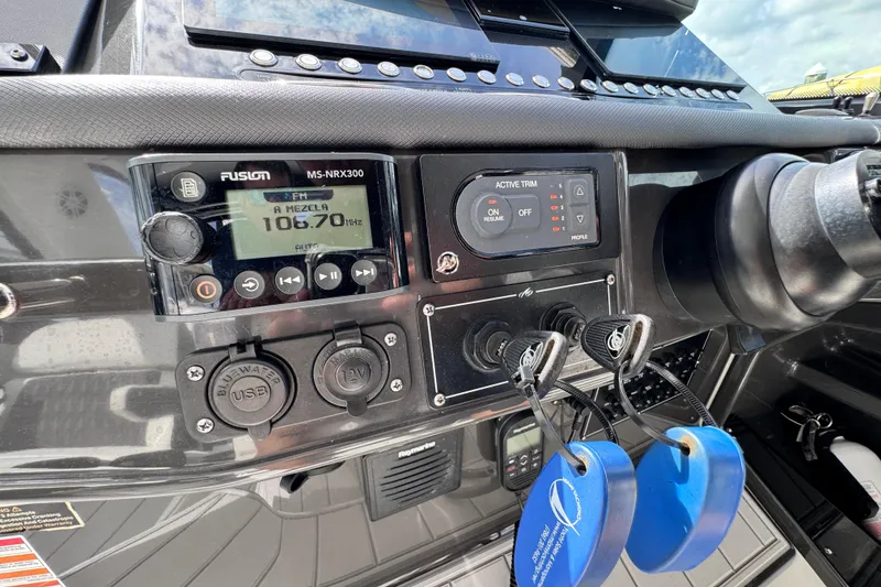 Slide: The Image of Control panel of 2021 Monterey 378 Super Express boat with radio and active trim. - 30