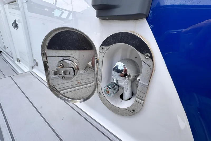 Slide: The Image of Fuel cap and water inlet on a 2021 Monterey 378 Super Express boat. - 32
