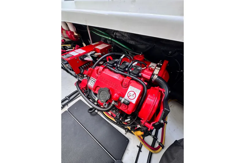 Slide: The Image of Engine compartment of 2021 Monterey 378 Super Express, featuring a red Westerbeke generator. - 35