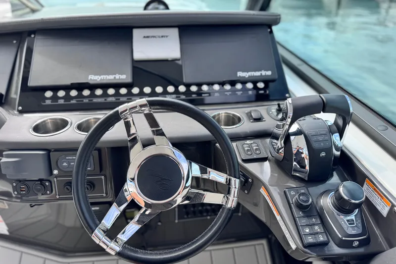 Slide: The Image of Cockpit of 2021 Monterey 378 Super Express with Raymarine navigation and Mercury controls. - 7