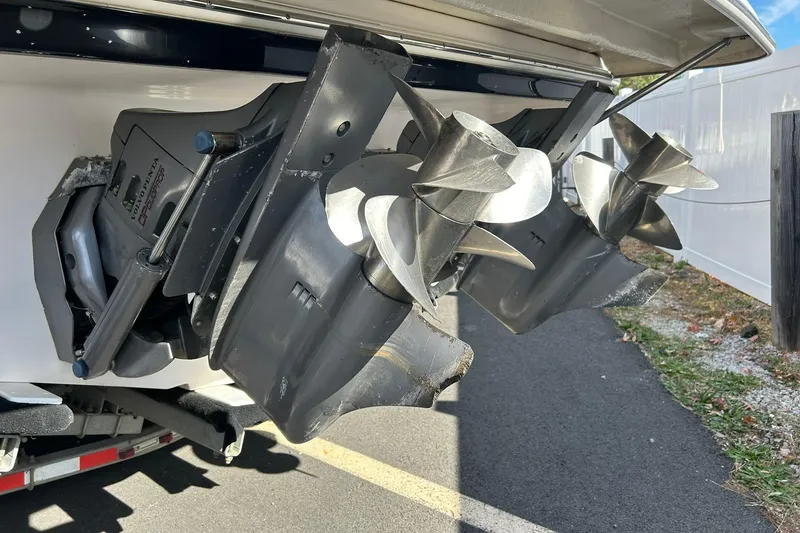 Slide: The Image of 2004 Regal Commodore 2860 boat propellers and outdrives in close-up view. - 9