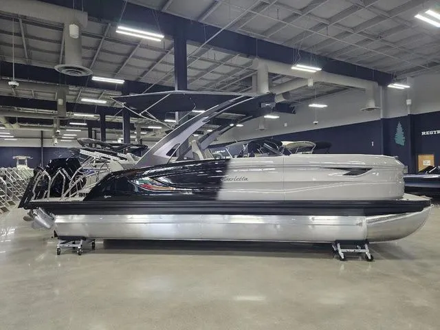 The Image of 2025 Barletta Boats R23UCA pontoon in showroom, featuring sleek design and modern amenities. - 1