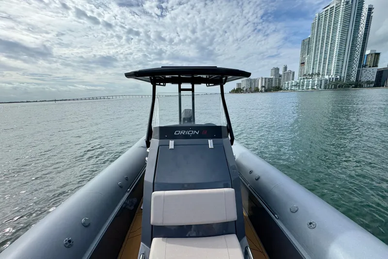 Slide: The Image of 2026 Northstar Orion 8 boat on water with city skyline in background. - 14