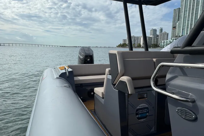 Slide: The Image of Northstar Orion 8 boat cruising near city skyline, 2026 model, with Mercury engine. - 24