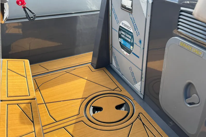 Slide: The Image of 2026 Northstar Orion 8 interior with wood flooring and Vitifrigo fridge. - 25