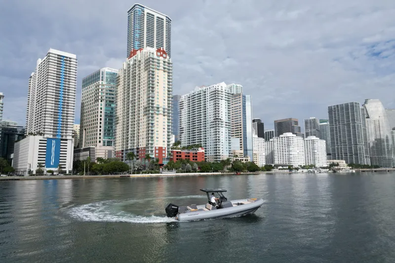 Slide: The Image of Boat cruising near city skyline, Northstar Orion 8, 2026 model. - 8