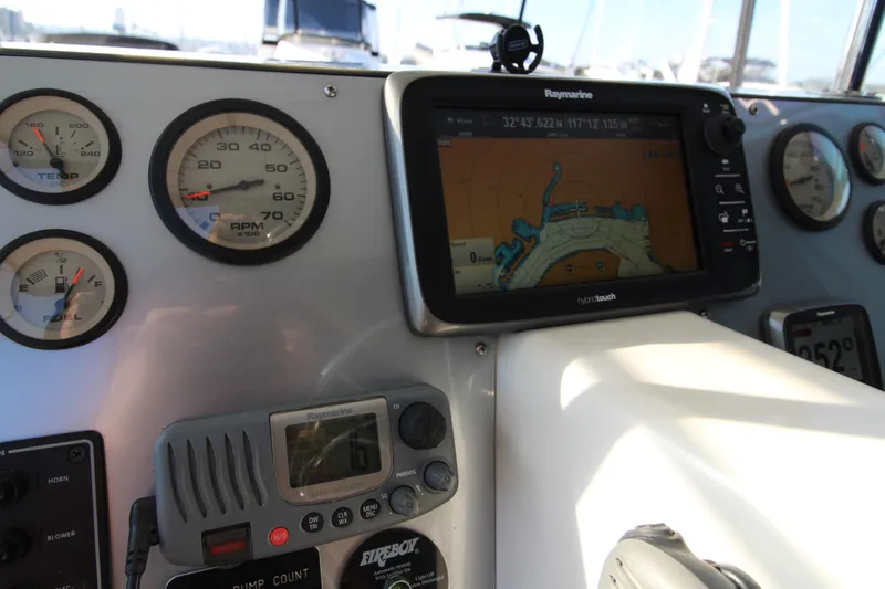 Slide: The Image of Control panel of a 1990 Carver 3467 Santego with navigation and gauges. - 13