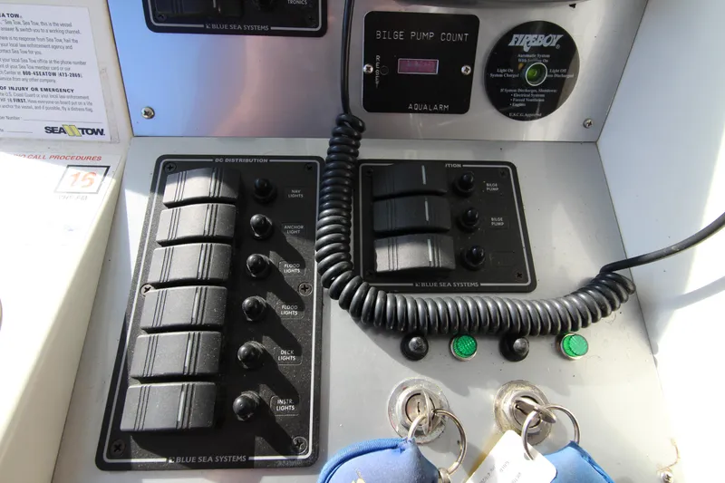 Slide: The Image of Control panel of a 1990 Carver 3467 Santego boat with switches and keys. - 14