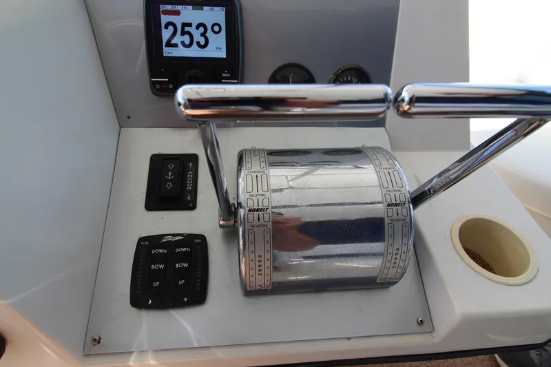 Slide: The Image of Control panel of a 1990 Carver 3467 Santego boat with throttle and navigation display. - 16