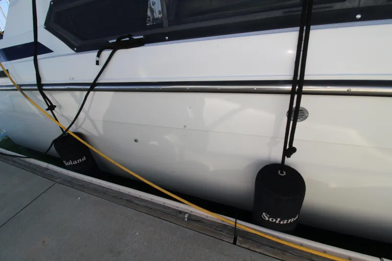 Slide: The Image of 1990 Carver 3467 Santego yacht docked with fenders and mooring lines. - 17