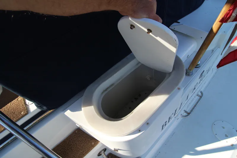 Slide: The Image of 1990 Carver 3467 Santego boat detail showing a compartment with an open lid. - 21