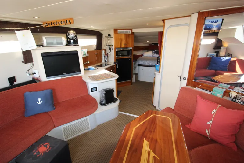 Slide: The Image of Interior of 1990 Carver 3467 Santego yacht with cozy seating and modern amenities. - 24
