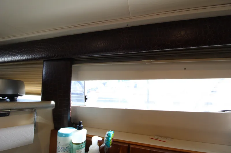 Slide: The Image of Interior view of a 1990 Carver 3467 Santego boat with window and toiletries. - 37