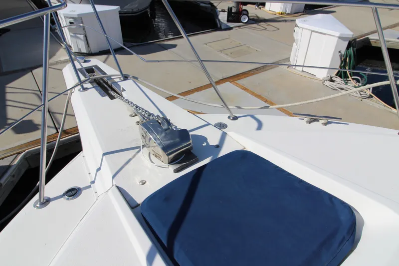 Slide: The Image of 1990 Carver 3467 Santego yacht deck with anchor and blue cushion. - 7