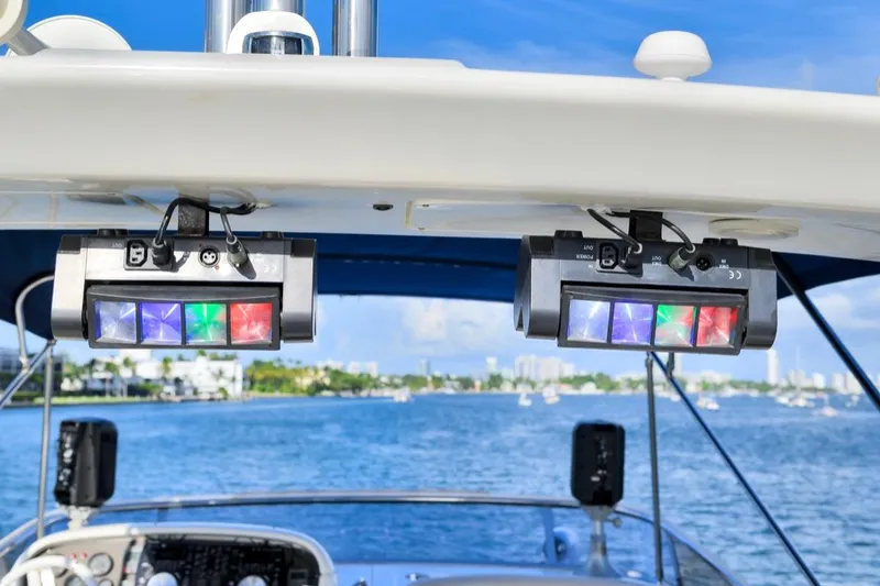 Slide: The Image of LED lights on a 2010 Azimut 62 Evolution yacht, with a scenic water backdrop. - 16