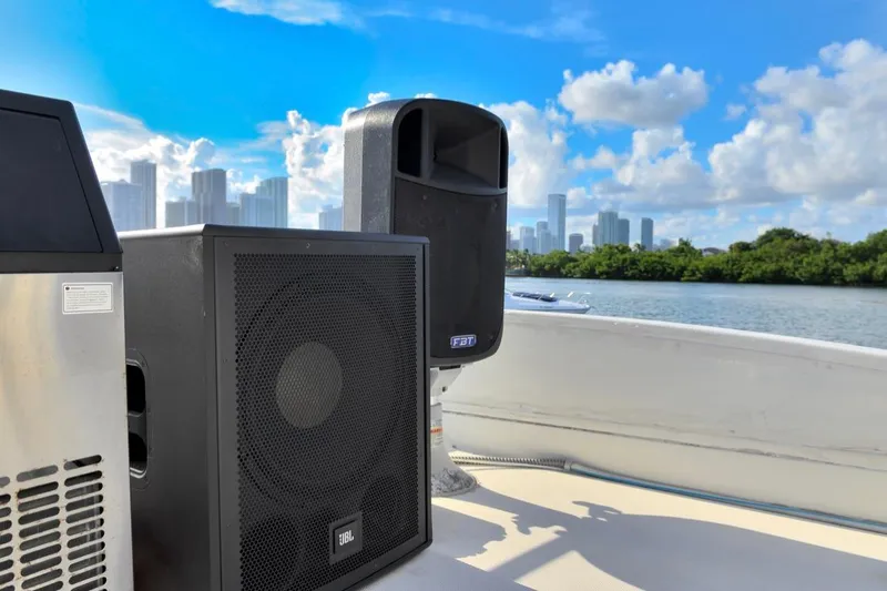 Slide: The Image of Speakers on 2010 Azimut 62 Evolution yacht with city skyline and water view. - 18