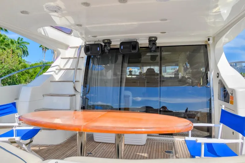 Slide: The Image of Luxurious 2010 Azimut 62 Evolution yacht deck with seating and table. - 4