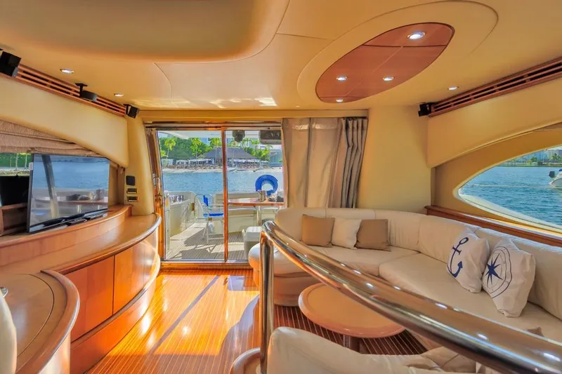 Slide: The Image of Luxurious interior of 2010 Azimut 62 Evolution yacht with elegant seating and scenic water view. - 9