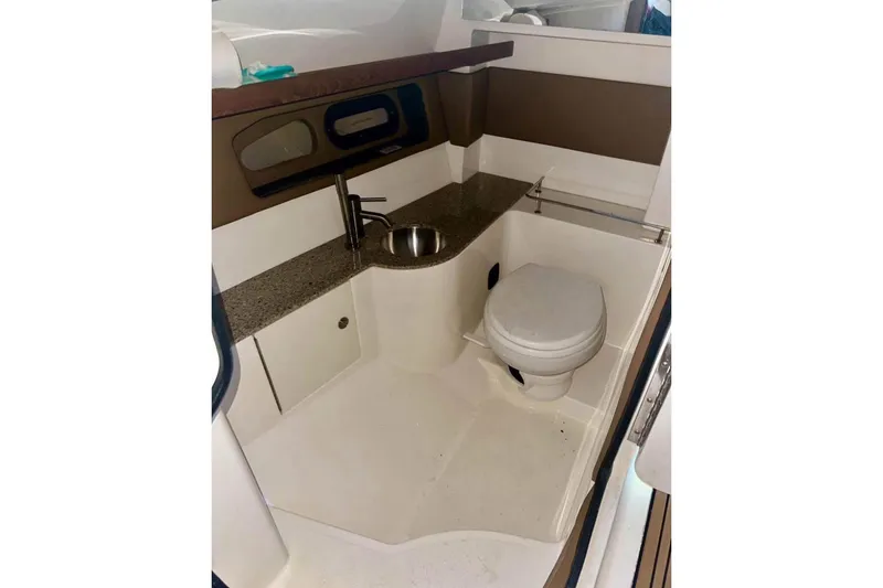 Slide: The Image of 2015 Sea Ray 350 SLX boat bathroom with sink and toilet. - 19