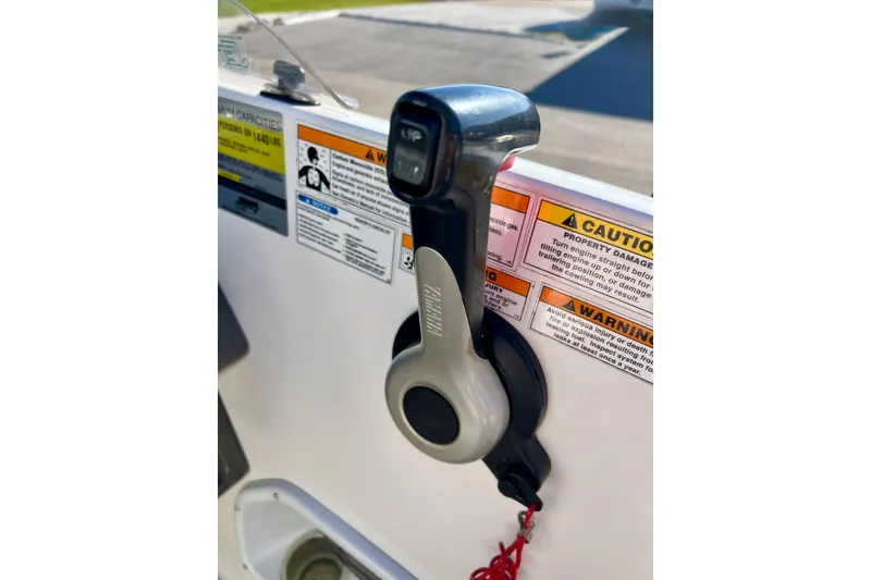 Slide: The Image of Throttle control of 2013 Hurricane SunDeck Sport 220 OB boat with safety warnings. - 19