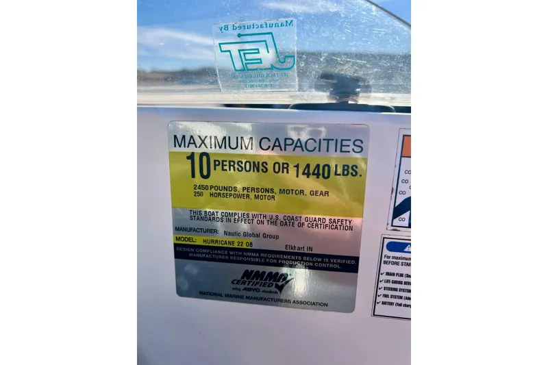Slide: The Image of Capacity label on 2013 Hurricane SunDeck Sport 220 OB, maximum 10 persons or 1440 lbs. - 20