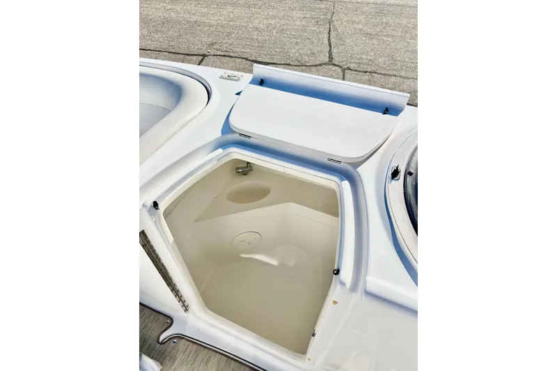 Slide: The Image of 2013 Hurricane SunDeck Sport 220 OB boat storage compartment with open hatch. - 39