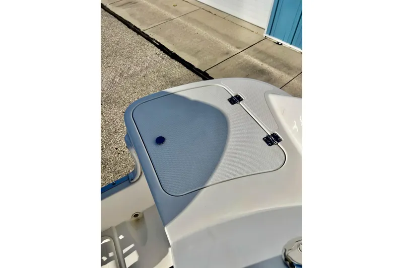 Slide: The Image of 2013 Hurricane SunDeck Sport 220 OB boat deck with storage compartment. - 43