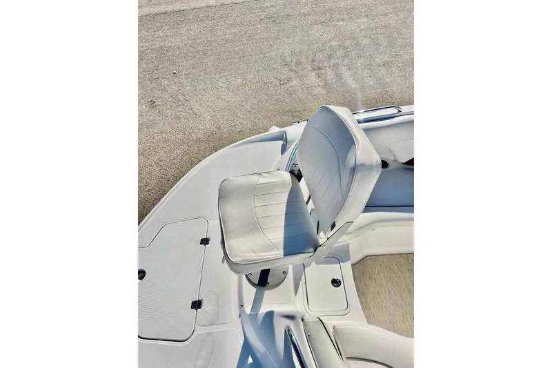 Slide: The Image of 2013 Hurricane SunDeck Sport 220 OB boat seat, white upholstery, on deck. - 53
