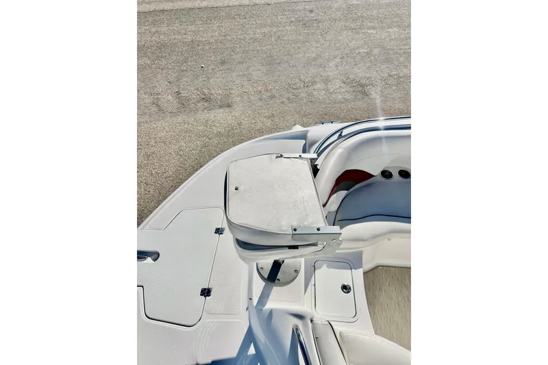 Slide: The Image of 2013 Hurricane SunDeck Sport 220 OB boat interior with seating and storage compartments. - 54