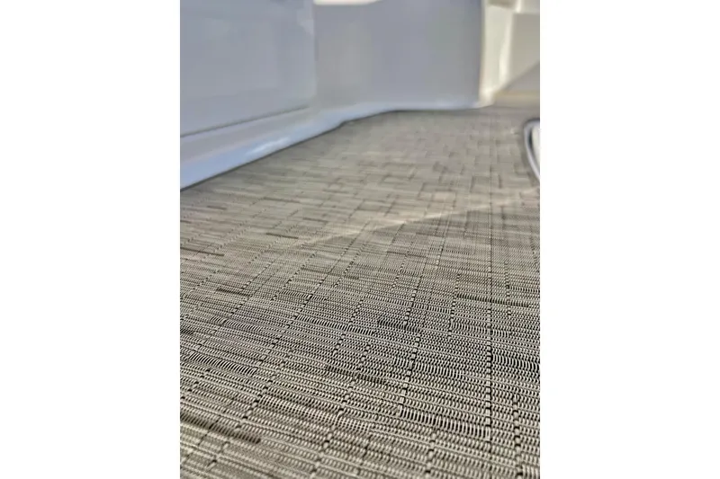 Slide: The Image of Close-up of textured flooring on a 2013 Hurricane SunDeck Sport 220 OB boat. - 59