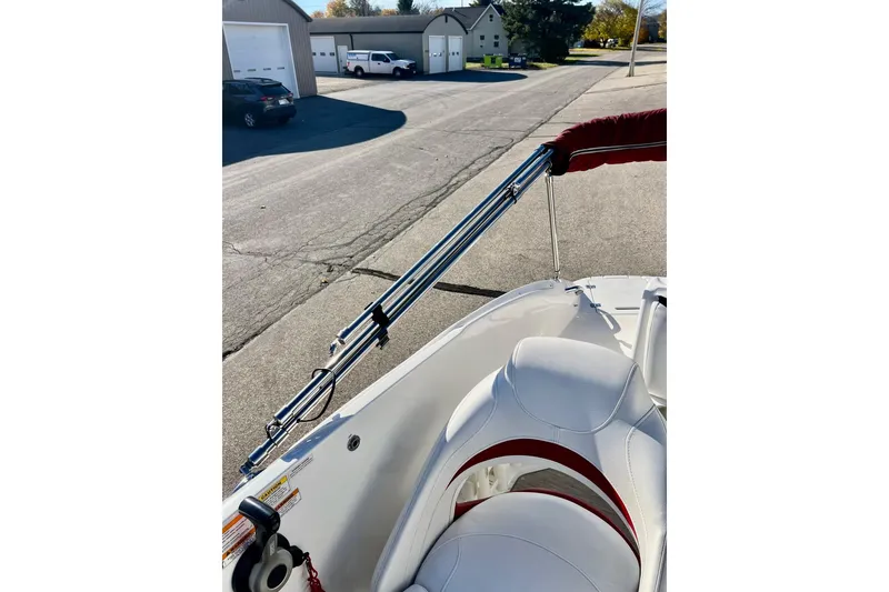 Slide: The Image of 2013 Hurricane SunDeck Sport 220 OB boat with white seating and red accents. - 61
