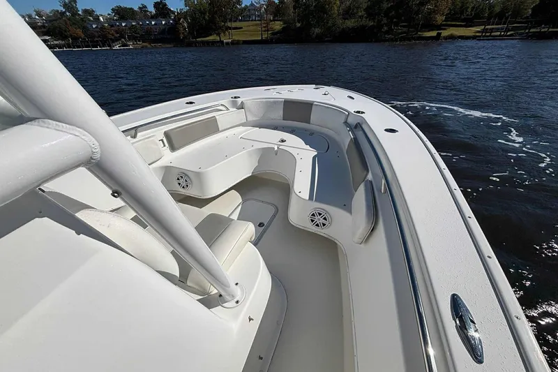 Slide: The Image of 2018 Cape Horn 24 XS boat with spacious seating on calm water. - 23