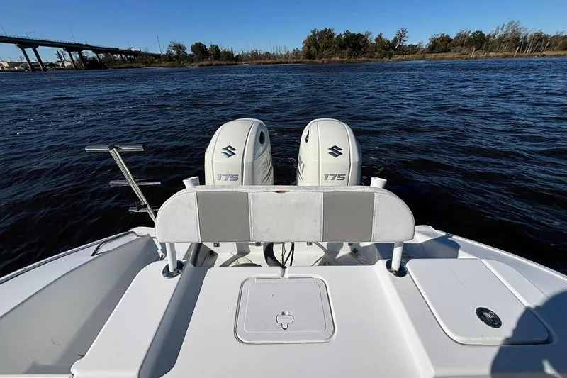 Slide: The Image of 2018 Cape Horn 24 XS boat with dual Suzuki 175 engines on a calm river. - 26