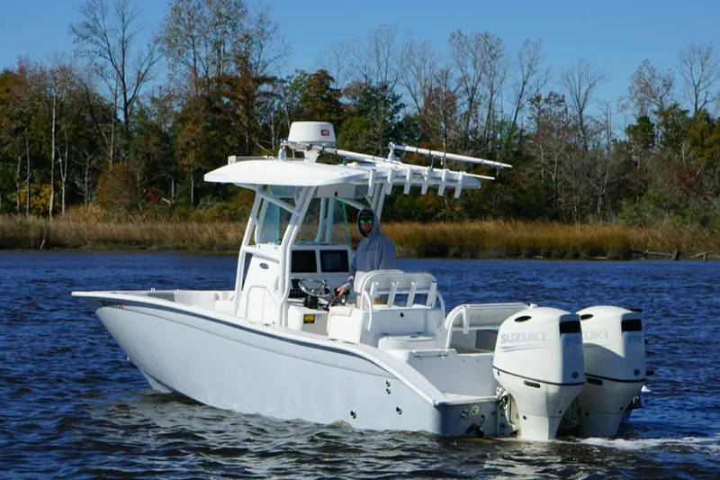 Slide: The Image of 2018 Cape Horn 24 XS boat with dual Suzuki engines on a calm river. - 4
