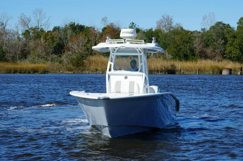 Slide: The Image of 2018 Cape Horn 24 XS boat on trailer under bridge. - 13