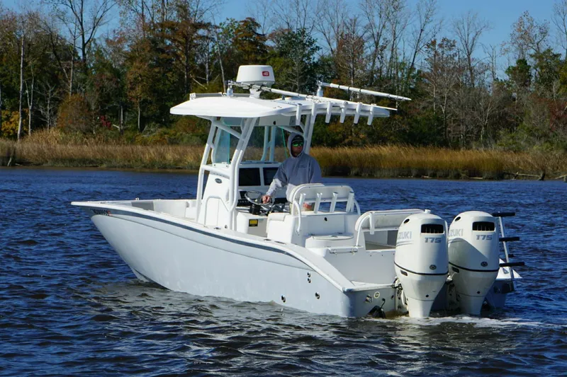 Slide: The Image of 2018 Cape Horn 24 XS boat with dual Suzuki engines on a calm river. - 3
