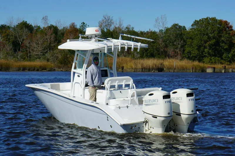 Slide: The Image of 2018 Cape Horn 24 XS boat with dual Suzuki 175 engines on a calm river. - 7
