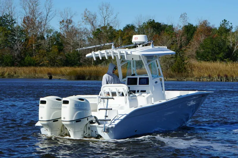Slide: The Image of 2018 Cape Horn 24 XS boat cruising on a scenic river. - 9