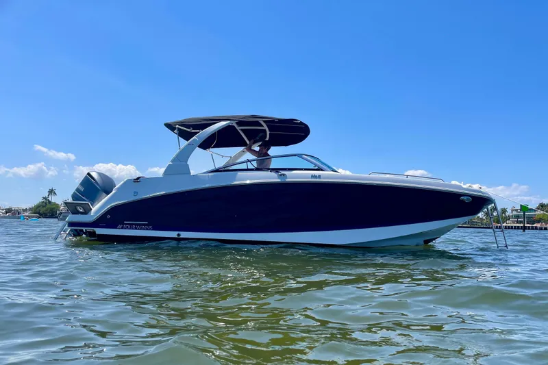 The Image of 2021 Four Winns HD5 OB boat docked at marina with canopy. - 0