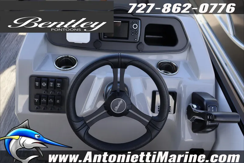 Slide: The Image of 2026 Bentley Pontoons Bolt 223 steering console with controls and branding. - 10