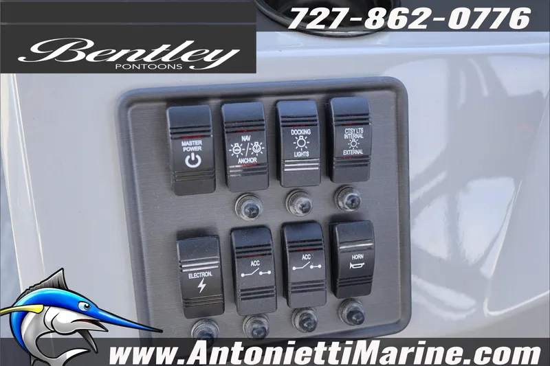 Slide: The Image of Control panel of 2026 Bentley Pontoons Bolt 223 with various switches and branding. - 11