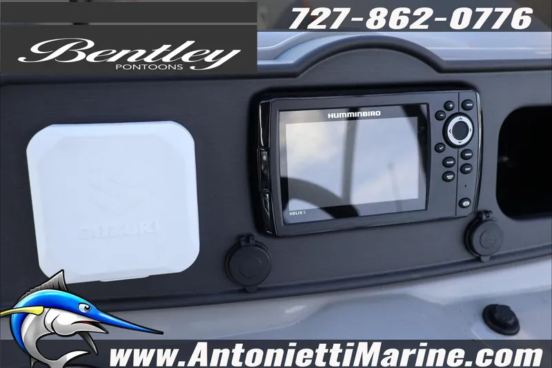 Slide: The Image of 2026 Bentley Pontoons Bolt 223 dashboard with Humminbird Helix 5 and Suzuki components. - 12