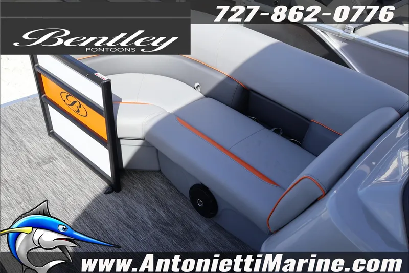 Slide: The Image of 2026 Bentley Pontoons Bolt 223 interior with gray and orange seating, displayed by Antonietti Marine. - 14