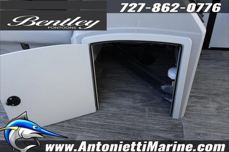 Slide: The Image of 2026 Bentley Pontoons Bolt 223 storage compartment with open door, displayed at Antonietti Marine. - 18