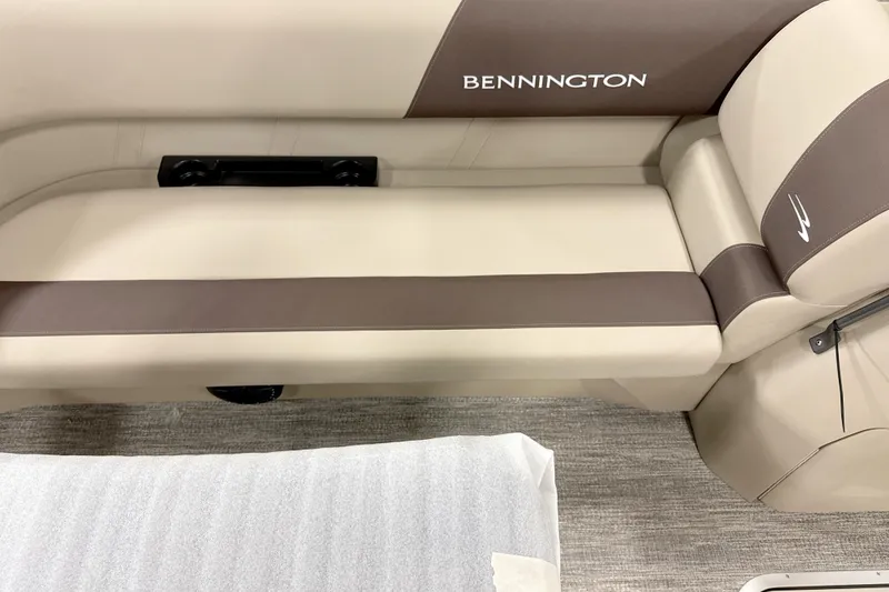 Slide: The Image of 2026 Bennington 22 S Swingback boat seat with beige and brown upholstery. - 3
