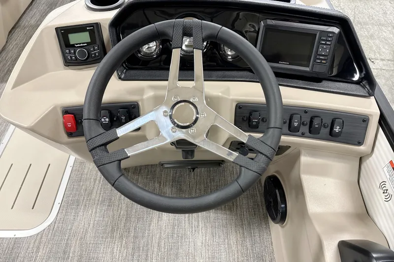 Slide: The Image of 2026 Bennington 22 S Swingback boat dashboard with steering wheel and control panel. - 6