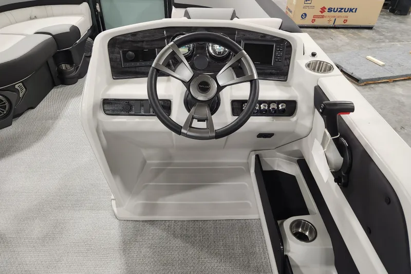 Slide: The Image of 2026 Avalon LSZ Cruise Rear Bench boat dashboard with steering wheel and controls. - 19